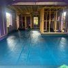 “Close-up of freshly applied liquid DPM forming a seamless waterproof barrier on concrete floor.”