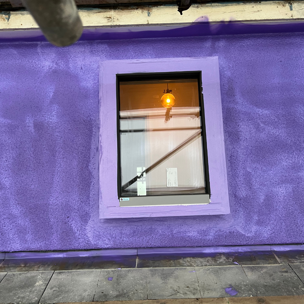 Liquid-applied airtight membrane installed before external insulation on an Oxford home retrofit.