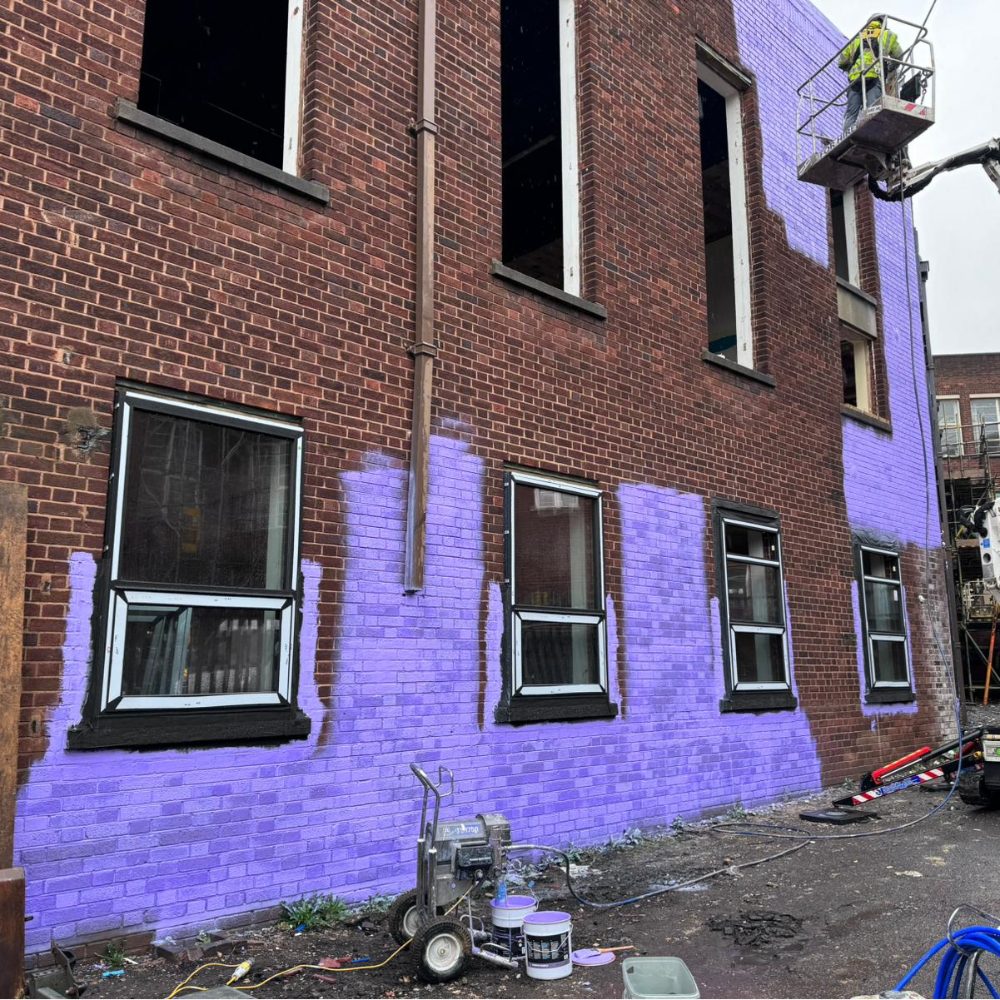 airtight liquid membrane being installed on a retrofit project