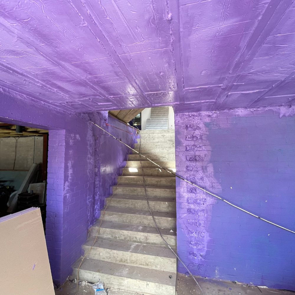 Application of Passive Purple Internal Vapour Control Layer to walls and ceilings for improved airtightness.