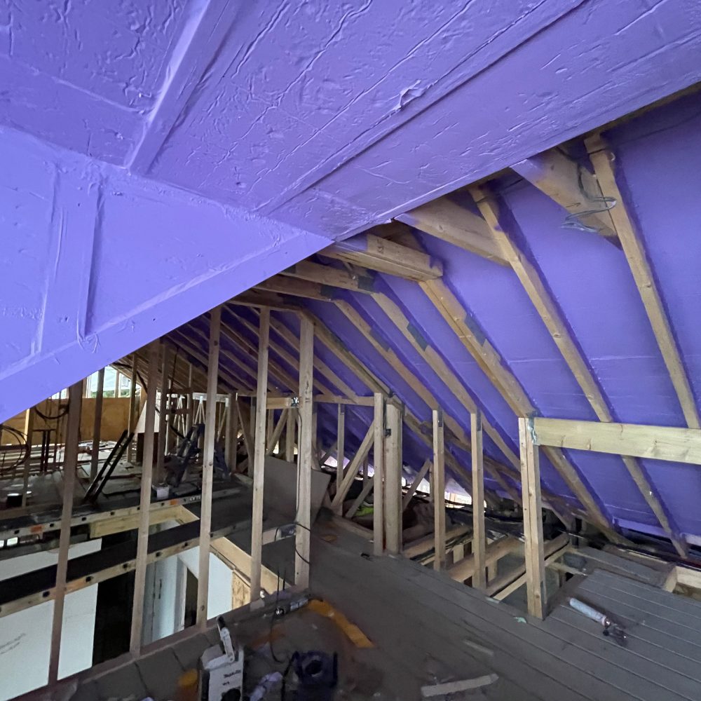 Loft area being sealed with Passive Purple products to create a continuous airtight building envelope.