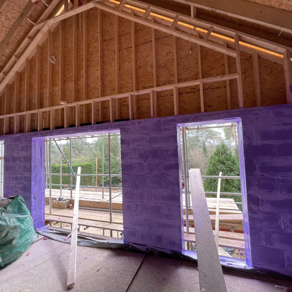 Home undergoing Passive Purple airtightness retrofit with full wall coverage in purple membrane