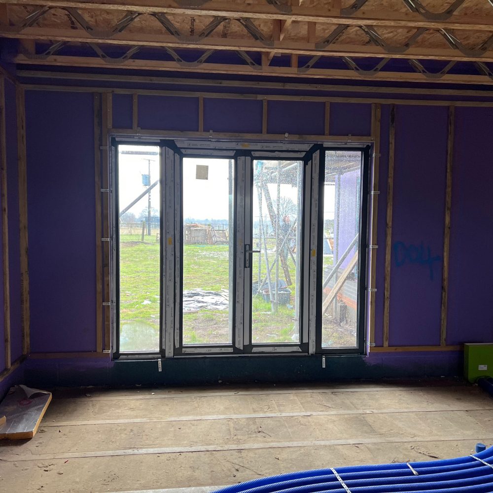 Passive Purple Brush used to seal window reveals and eliminate air leakage points in an eco self-build project