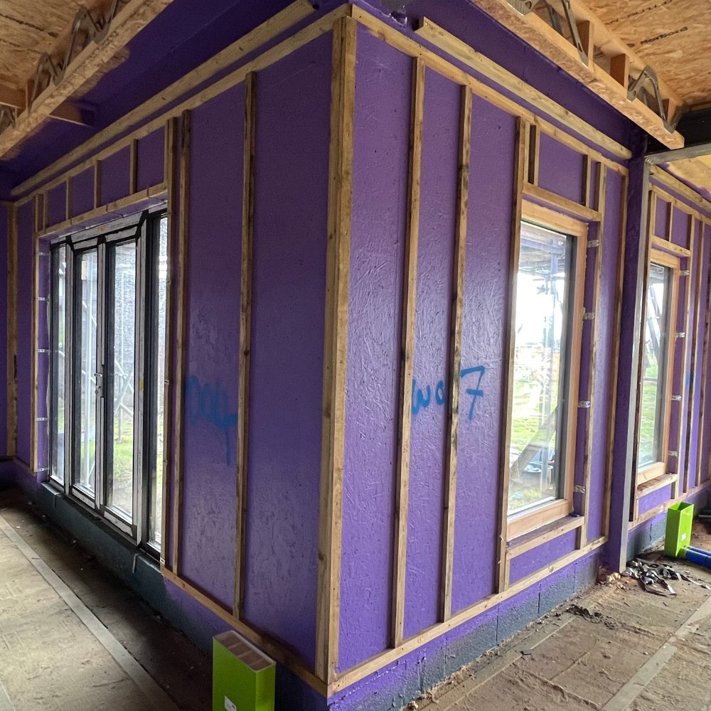 Airtight fleece membrane fitted around door frames to strengthen the airtight seal before applying Passive Purple.