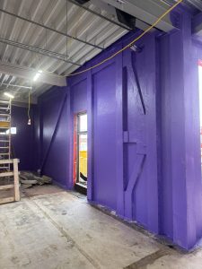 Airtightness solution using Passive Purple liquid membrane applied to Bedford Academy LGS frame.